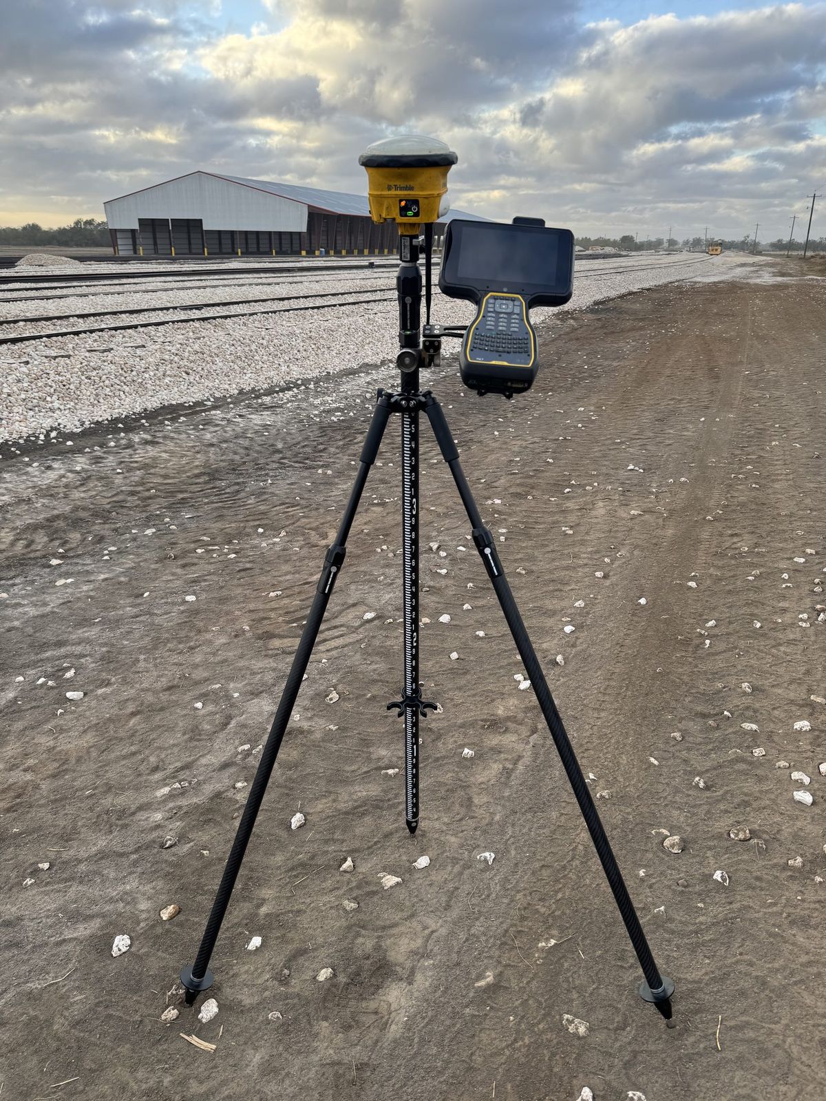 GPS rover set on a commercial site pad