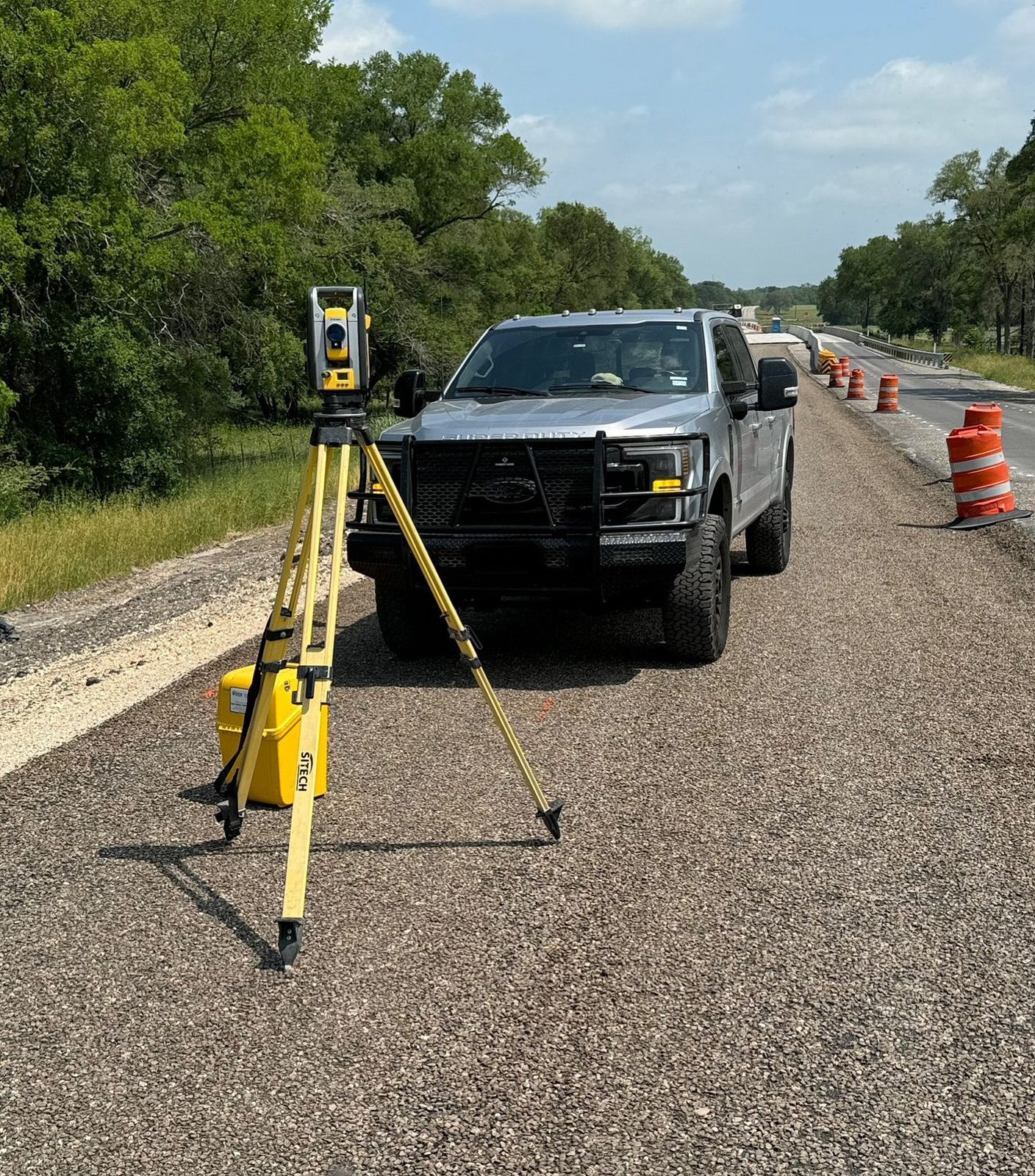 Total station set up on an active road project